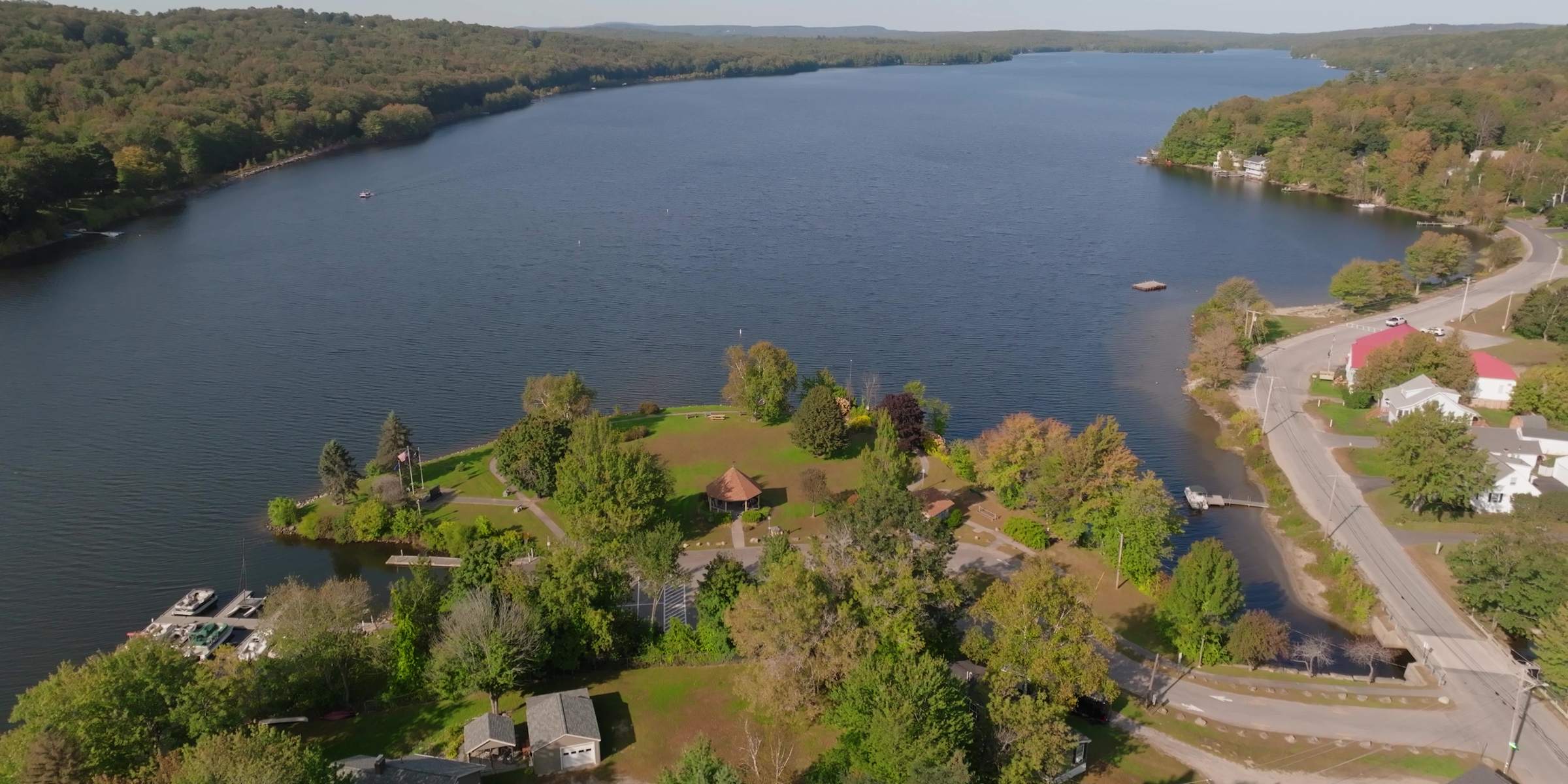 Aerial view of a lake in Winthrop, Maine, with a wooded point reaching into the water