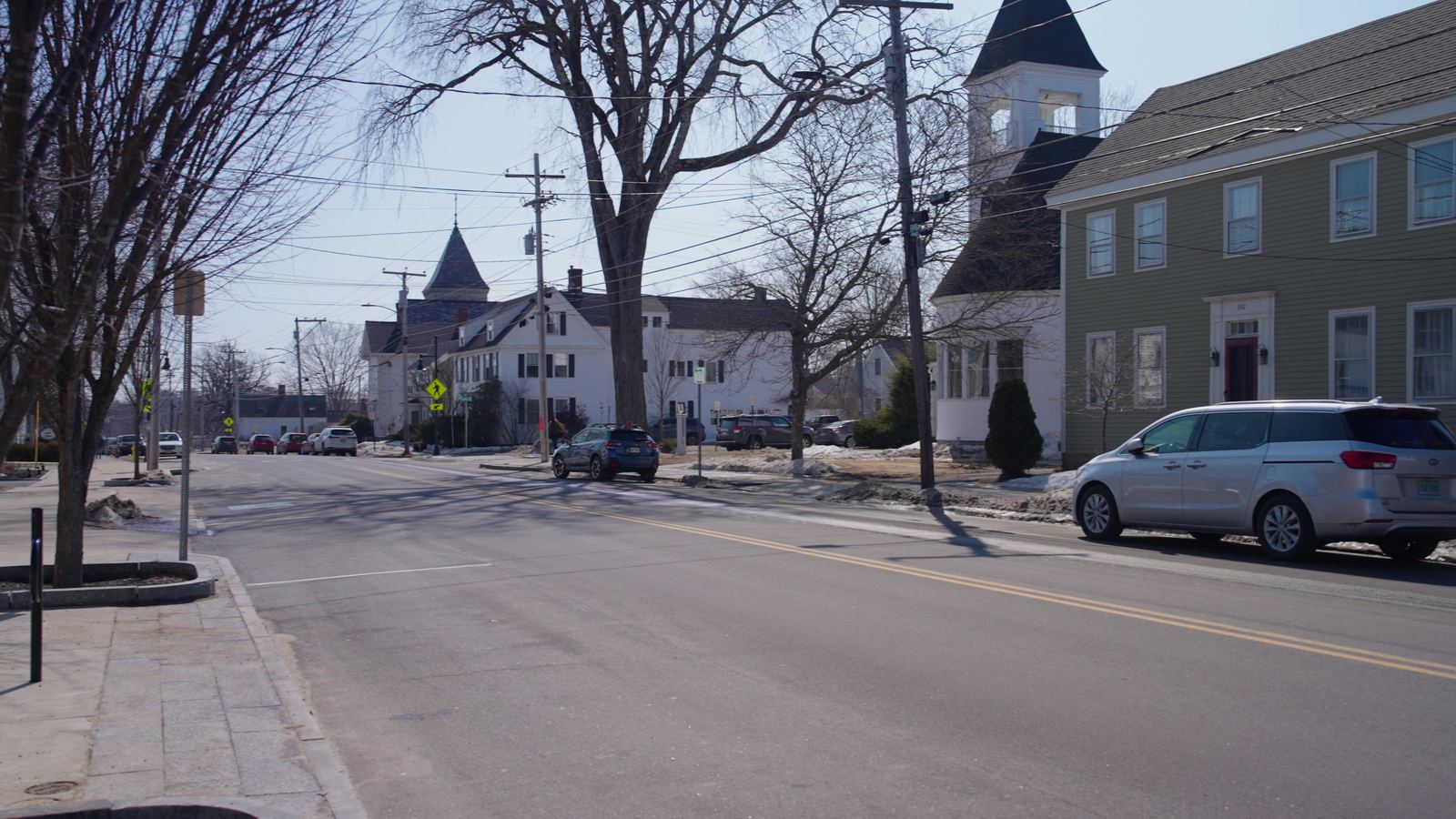 Main Street in Yarmouth, Maine, in winter with snow along the roadside
